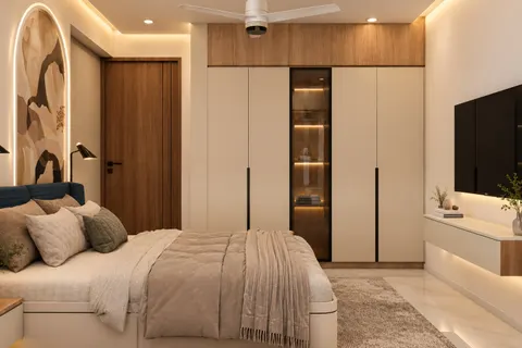 Bedroom, wardrobe wall, Gulmohar House. Handle-less wardrobes around a lit glass display, with the mural arch beside the bed.